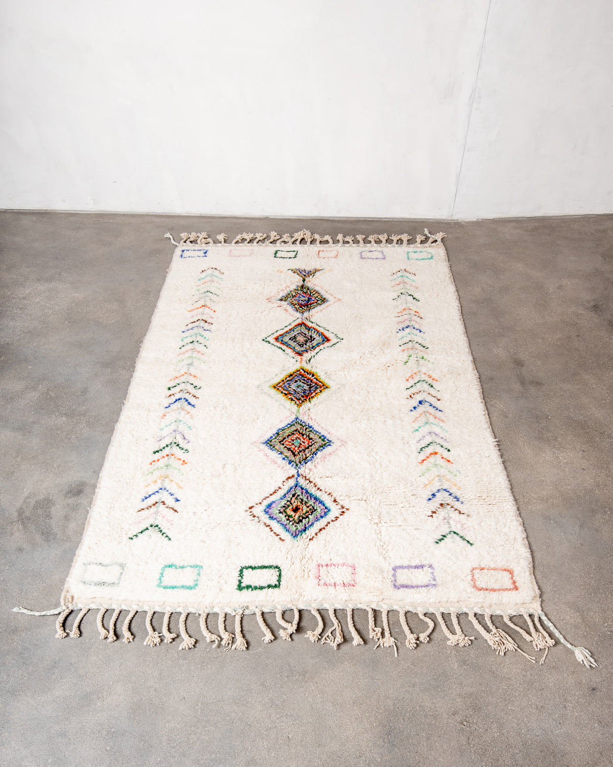 Modern, designer, handcrafted Berber rug from Morocco. Beniourain carpet with beautiful colours and patterns and fluffy wool texture.